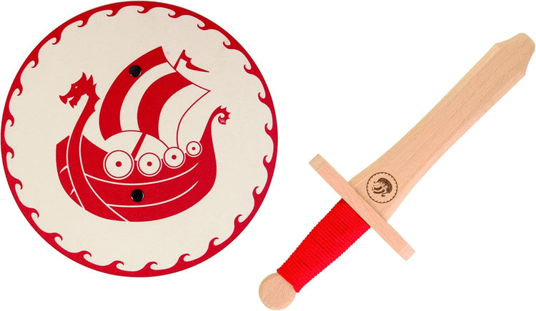 Kinderspielset mit rundem Schild und Holzschwert. Der weiße Schild zeigt ein rotes Drachenboot mit gezacktem Wellenrand. Das Schwert hat eine rote Griffwicklung und ein Wikingerboot als Gravur.